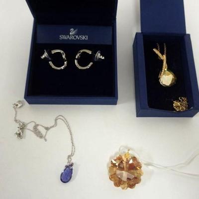 1092	SWAROVSKI CRYSTAL JEWELRY, AMBER GOLD TONE NECKLACE IN BOX, PIERCED EARRINGS, HEART NECKLACE ON RIBBON AND PURPLE CRYSTAL NECKLACE
