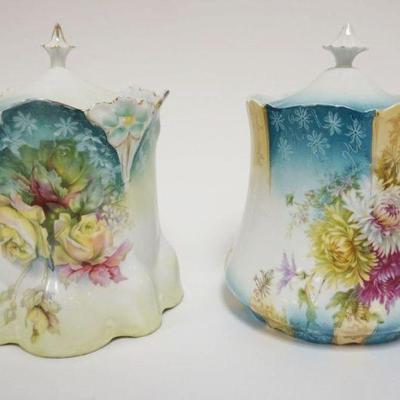 1035	2 VICTORIAN BISCUIT JARS EACH HAVING IMAGES OF FLOWERS, APPROXIMATELY 6 IN X 6 IN X 8 IN
