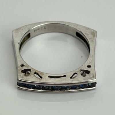 A 14k White Gold Heart-Themed Sapphire Line Ring