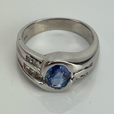 An 18k White Gold 1 Carat Oval-Cut Sapphire & Natural Diamond Ring