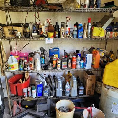 Shelving Unit With Various Automotive Chemicals and Accessories