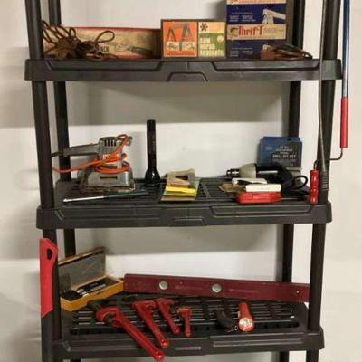 Plastic shelving unit with tools and hardware