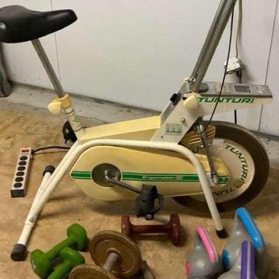 Stationary exercise bike and free weights