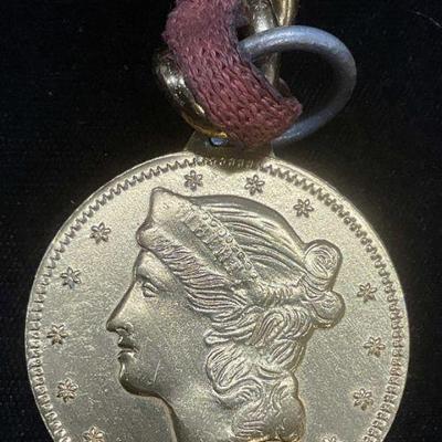 Gold Tone Coin Motif Pendant Necklace

