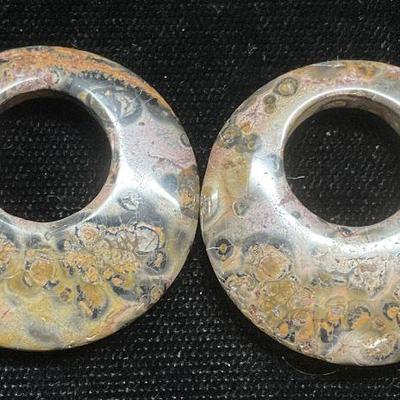 Pair Carved Round Stone Pendants
