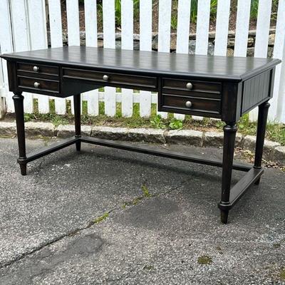 CARVED WOOD DESK | Carved wood desk with center drawer flanked by 2 drawers with border stretcher Dimensions: h. 30.5 x w. 58 x d. 28 in.
