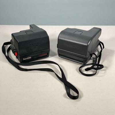 (2pc) Polaroid Cameras | Including: Sun 660 Auto Focus, and other polaroid camera. Dimensions: h. 4 x w. 4.5 x d. 6 in
