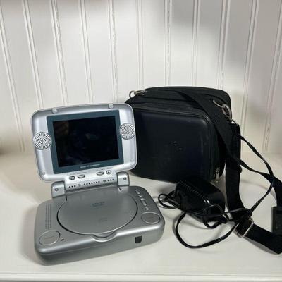 Portable DVD Player | DVD/CD/MP3 player. Go Vision DVD Travel Theater. Comes in carrying case with power chord. Dimensions: h. 8 x w. 6 x...