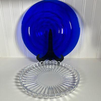 (2pc) GLASS SERVING DISHES | Set of 2 glass serving dishes, one blue glass with ripple design, other clear glass. Dimensions: dia. 15 in...