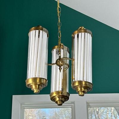 ART DECO MILK GLASS ROD HANGING FIXTURE | Designed as three milk glass-rod or glass tube fixtures joined by a brass mount and suspended...