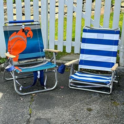 (2pc) BEACH CHAIRS | Including: Margaritaville folding beach chair with pocket, cup holder, and backpack straps; and stripped beach chair...