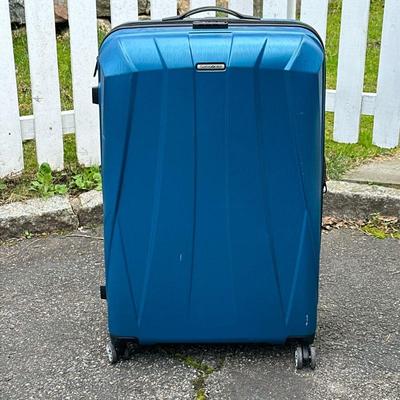 Blue Samsonite Luggage | Hard shell rolling suitcase Dimensions: h. 31 x w. 20.5 x d. 12.5 in.

