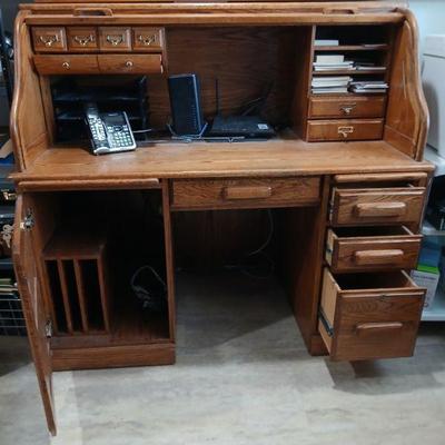 Wood roll top office desk. 49."h x 53.5"w x 28.5"d. Asking $100.