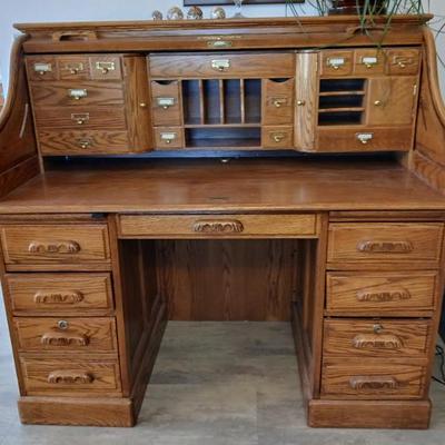 Oak roll top desk.. Good condition. 49.5"h x 54"w x 30"d. Asking $200..