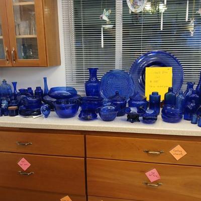 We found some more cobalt blue plate ware to add to the collection. Tall vase in back has a crack on the top. Other pieces are in good...