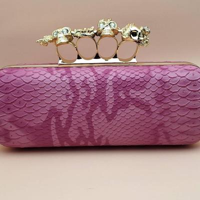 Pink Python-Texture Clutch with Gold Skull Knuckle Handle
