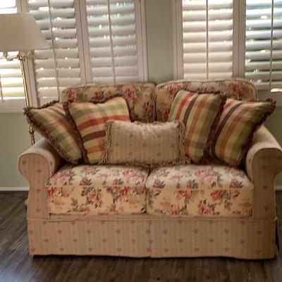 Ashley Loveseat In Creams And Coral Rose and Brass Floor Lamp