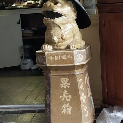 He is a municipal trash receptacle from Beijing. He's ceramic, weighs about a hundred pounds, and we love him too!  
