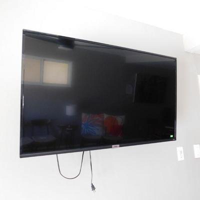 TCL Roku TV, includes wall mount and stand feet
