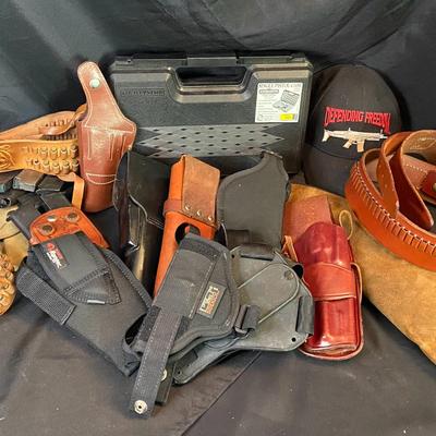 Assortment of Gun Holsters And Magazines