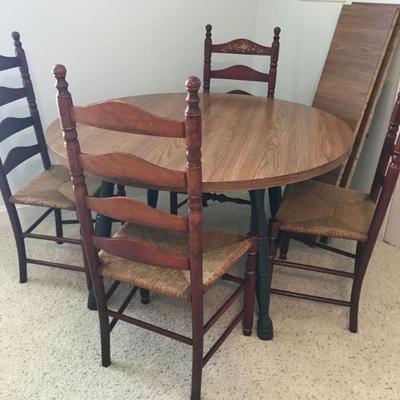 48" round table with two 12" leaves $99
set of 4 ladder back chairs with rush seats $240