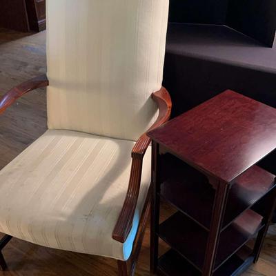 Beige Upholstered Accent Chair And Small Wooden Shelf