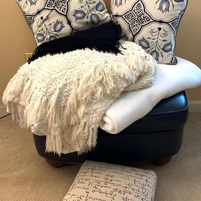 Ottoman With Pillows And Blankets Including A Small Foot Stool