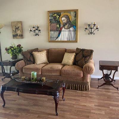 beautiful brown formal couch with tassel skirting 