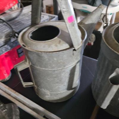 Vintage galvanized watering cans