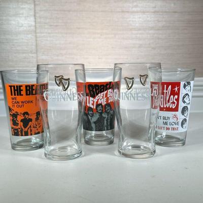 (5pc) BEATLES & GUINNESS PINT GLASSES | Including: pair of Guinness pint glasses, and 3 Beatles pint glasses - h. 6.25 x dia. 3 in....