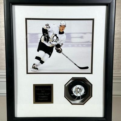 SIDNEY CROSBY SIGNED PUCK | Signed Sidney Crosby Penguins hockey puck in shadow box frame - h. 18.75 x w. 15.75 x d. 3 in.
