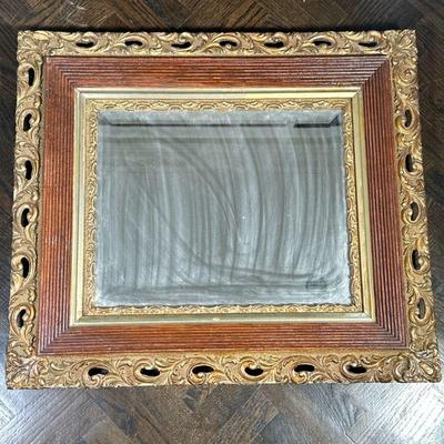 WOOD & GILT MIRROR | Beveled glass mirror in carved wood & gilt frame - h. 27.5 x w. 31 in.
