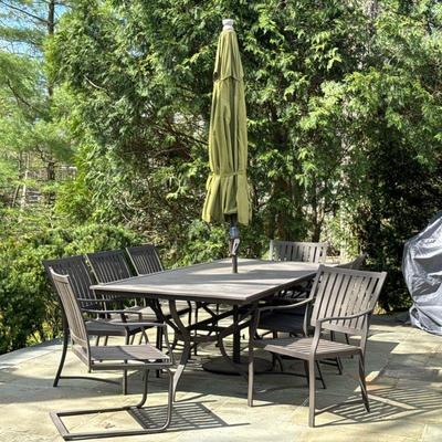 (10pc) CRATE & BARREL PATIO DINING SET | Including six armchairs two spring armchairs, a table and umbrella - h. 28 x w. 41.5 x l. 98...