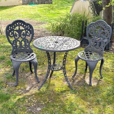 (3pc) CAST ALUMINUM PATIO SUITE | Comprising two side chairs and a round table with a tripod base - h. 28 x dia. 26 in.
