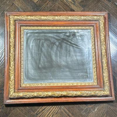 CARVED WOOD MIRROR | Beveled glass mirror in carved wood & gilt frame - h. 26 x w. 30 in.
