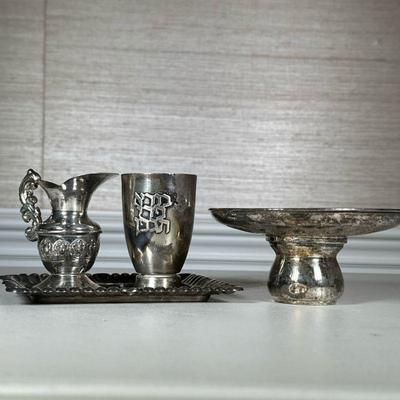 RELIGIOUS SILVER ITEMS | Including: religious silver hand washer, kiddish cup, and silver tray; total weight: 12.5 ozt. - h. 5.5 x dia....