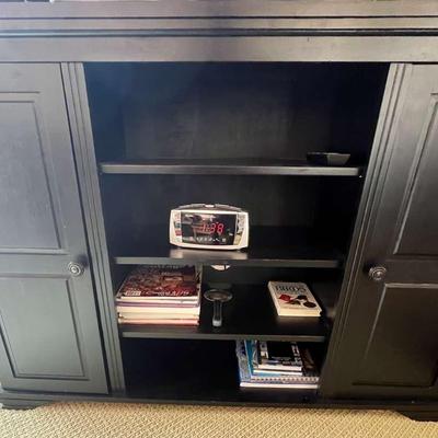 Black Cabinet With Books, DVDs, & Clock
