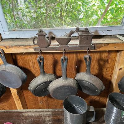Cast Iron Pans, Hanging Rack And Flour Sifters 