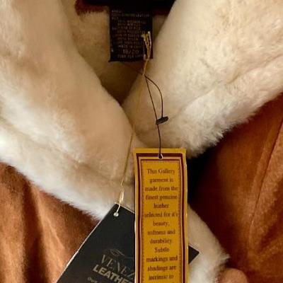 Suede coat has tags