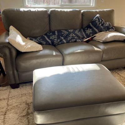 Tan leather couch with ottoman