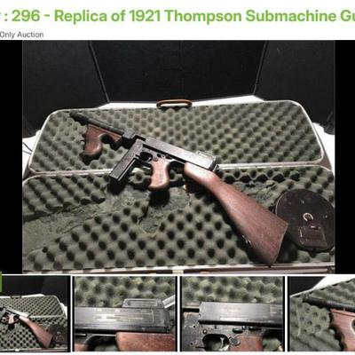 Lot # : 296 - Replica of 1921 Thompson Submachine Gun
Number 0801 model of a 1921 submachine gun with drum and stick magazine and carry...