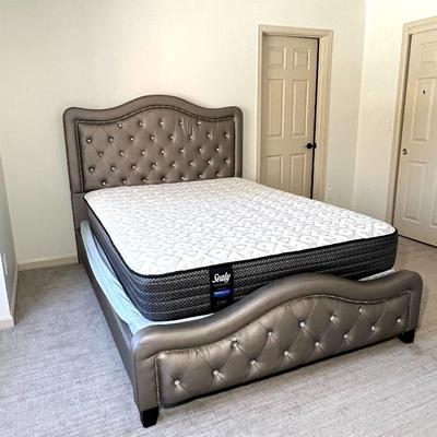 Queen size bed with a beautifully tufted headboard and a Sealy Performance mattress and box spring. Includes a sturdy frame with...