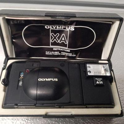 vintage Olympus camera in case