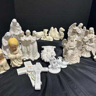 Ceramic Nativity Pieces Featuring Lyrical Angels And Cross Wall Fixtures