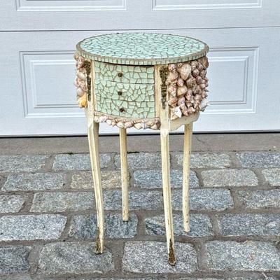 SEASHELL & GLASS MOSAIC SIDE TABLE | A whimsically decorated oval side table with inlaid glass mosaic and seashells having 3 drawers...