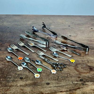 (15pc) MIXED SILVER PLATE UTENSILS | Including: 3 tongs, Grape scissors, 5 forks, teaspoon, and 5 1983 Seoul commemorative teaspoons.