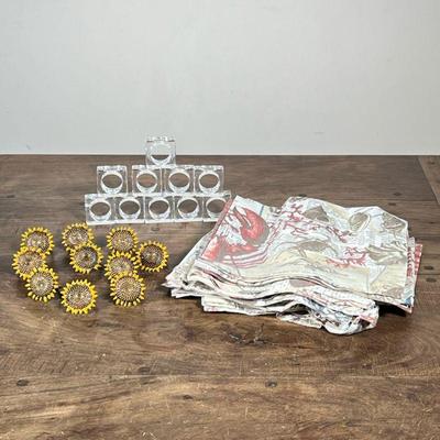 (34pc) NAPKINS & NAPKIN RINGS | Including: Set of 14 Pottery Barn napkins, 10 brass sunflower napkins rings, and 10 clear acrylic...
