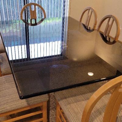 GLASS-TOPPED DINING ROOM TABLE WITH 8 WOOD CHAIRS 