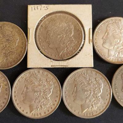 SEVEN LATE 1800s MORGAN SILVER DOLLARS