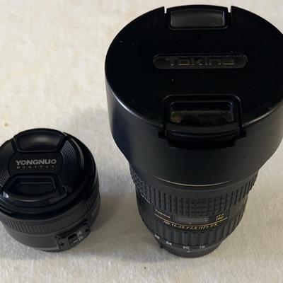 Two professional camera lenses featuring Tokina;  Both were used on a Nikon